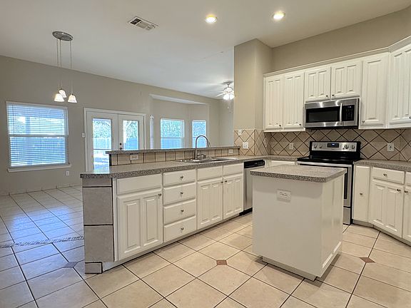 Kitchen opens to the den area
