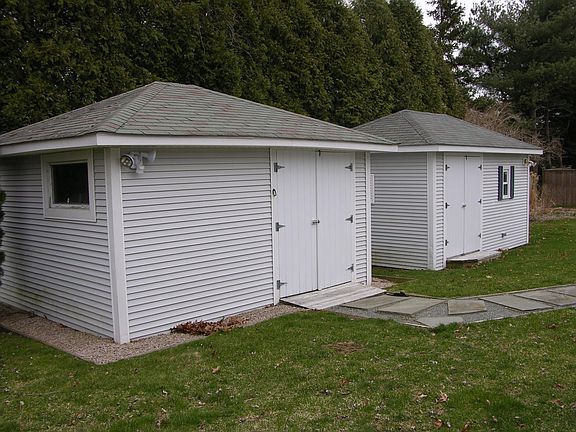 Two outbuildings provide plenty of storage space.