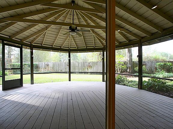  STUNNING screened in porch in backyard