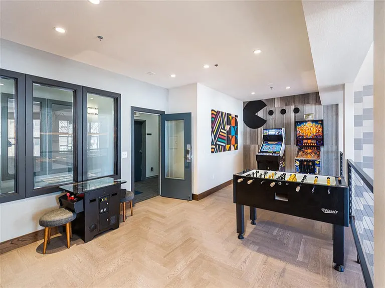 Game room with foosball and arcade games like pinball