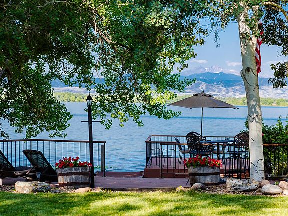 Lounge/sunbathing area and private deck with patio dining set for 6 over the water.