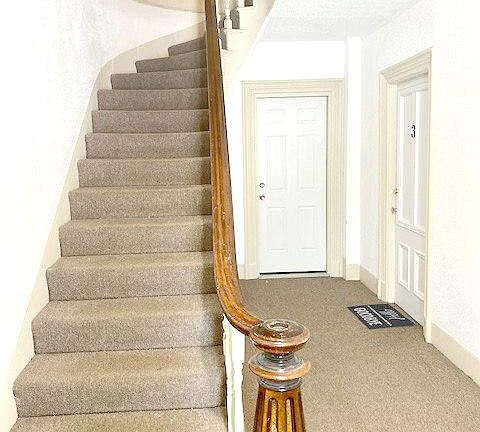 Open, bright stairwell to your apartment.