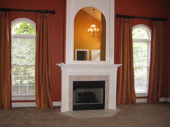 Living Room w/fireplace & vaulted ceiling