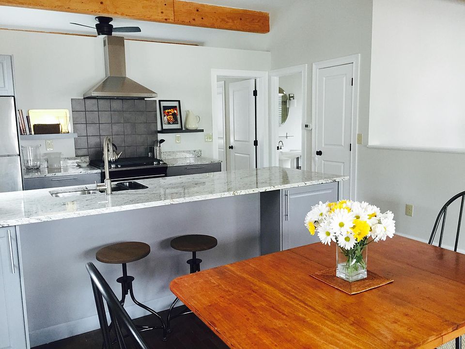 Lots of kitchen storage with a separate pantry, granite counter tops, breakfast bar seating, and stainless steel appliances, including a gas stove.