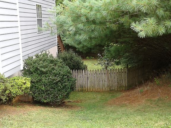 Side to Fenced Backyard