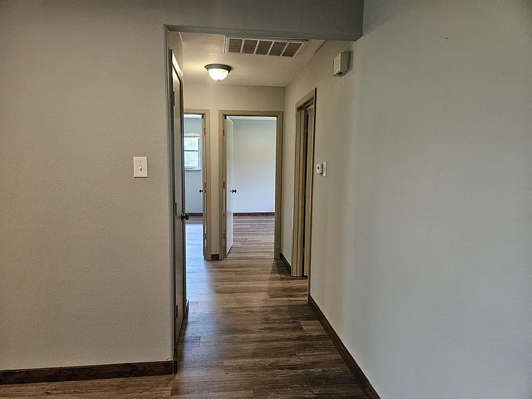 Hallway leading to 3 bedrooms and hall bathroom