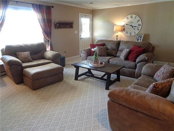 ANOTHER VIEW OF THE BRIGHT AND CHEERY LIVING ROOM