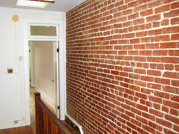 Exposed Brick Stairway and Hallway