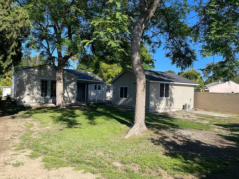 Large backyard with two patio areas. Great for pets and entertaining.

Detached garage with door access, lots of natural light and Air Conditioning.