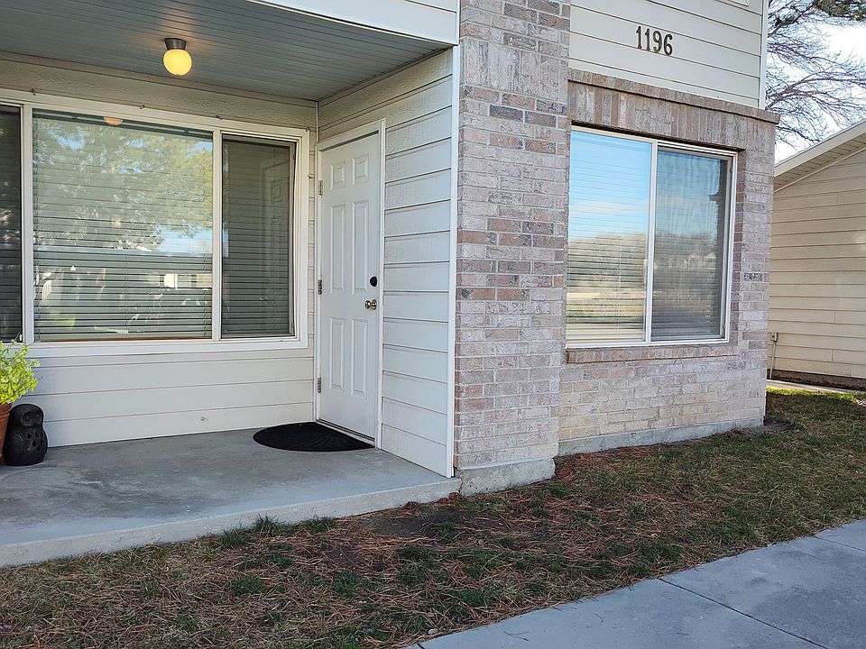 Back Door with Patio next to Garage. Easy access.