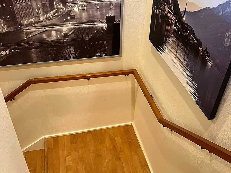 From inside stairwell and landing to downstairs