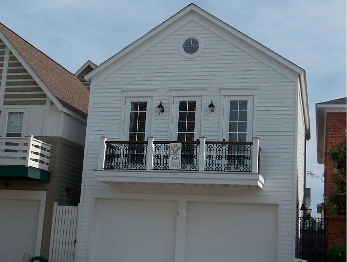 West facing facade, balcony, (great room)