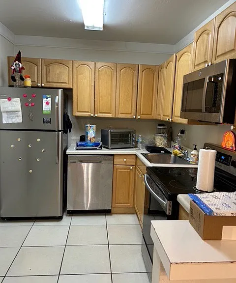 kitchen with granite counter top and stainless steel appliances