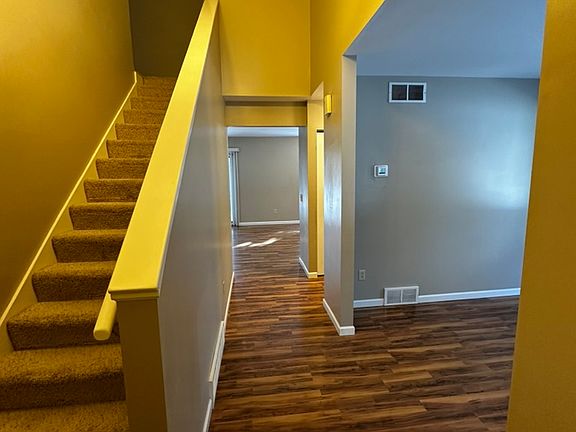 Front foyer. Hardwood surface for the 1st floor. Carpets for the stairs and 2nd floor.