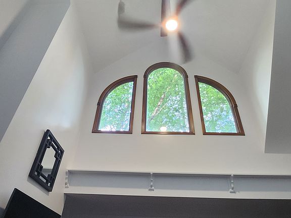 great room cathedral ceiling, fan and windows