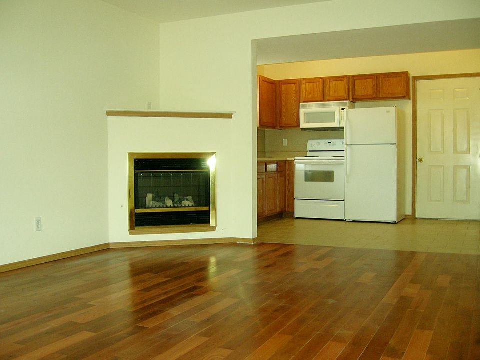 Kitchen fully equipped with Dishwasher, Refrigerator, Electric Stove, Microwave & Disposal; Livingroom with Electric Fireplace and Wood floor.