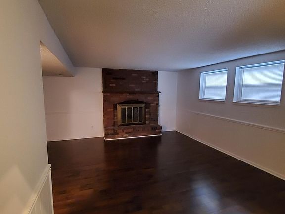 Finished basement with fireplace