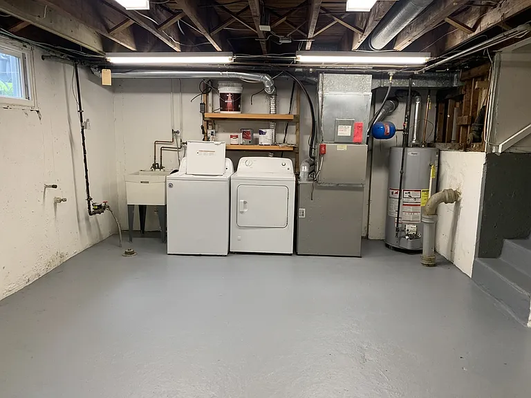 Basement level with full sized laundry and storage
