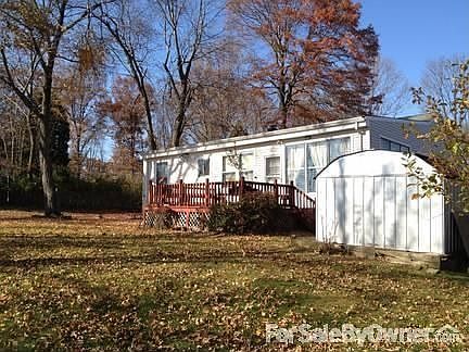 Front Yard
						:
						Park Like setting with Tree lined Property