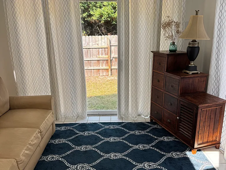 Sunroom with Queen + sofa bed sleeping two. The home sleeps 6 total with Queen beds in each respective bedroom too.