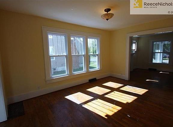 Formal Dining Room Connects Living Room and Kitchen
