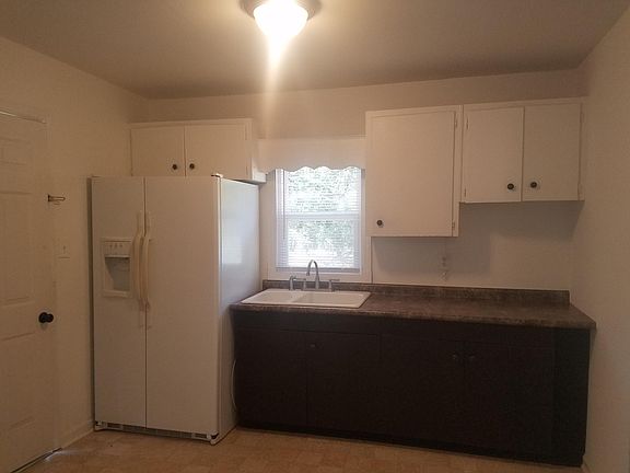 New porcelain sink & beautiful countertops & cabinets