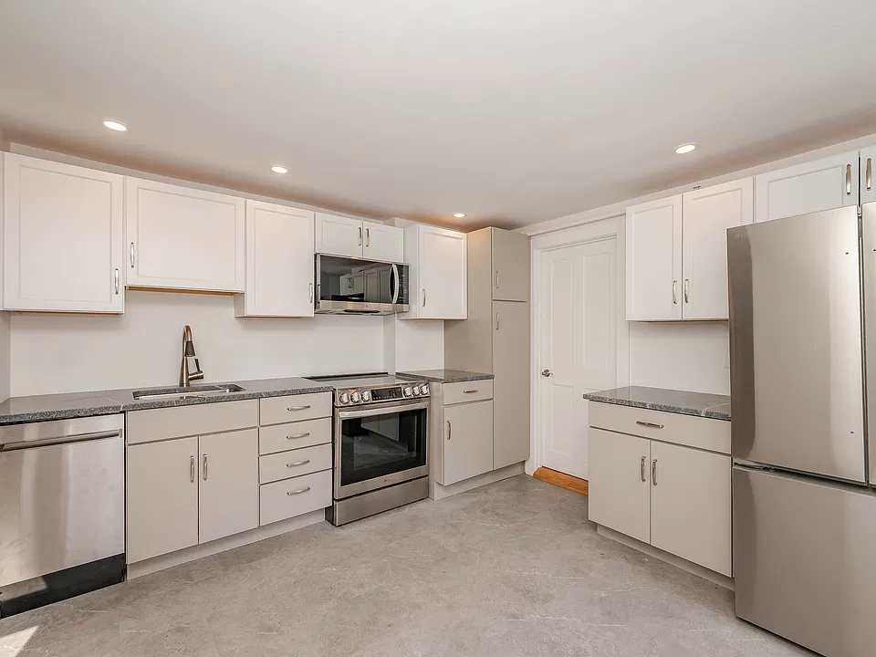 Stainless steel appliances including dishwasher and microwave