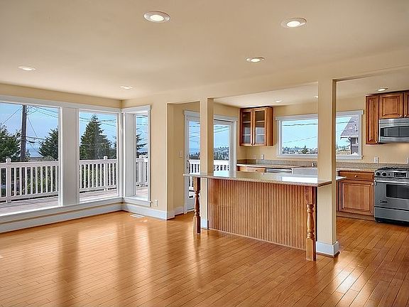 Great room, floor to ceiling windows, eating bar