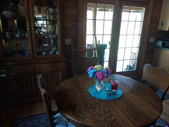 Dining area with window and patio door for great views of the land