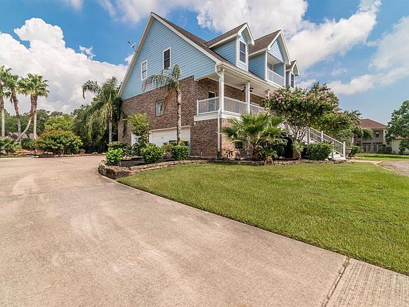 A full circle drive and separate driveway has parking for large gatherings