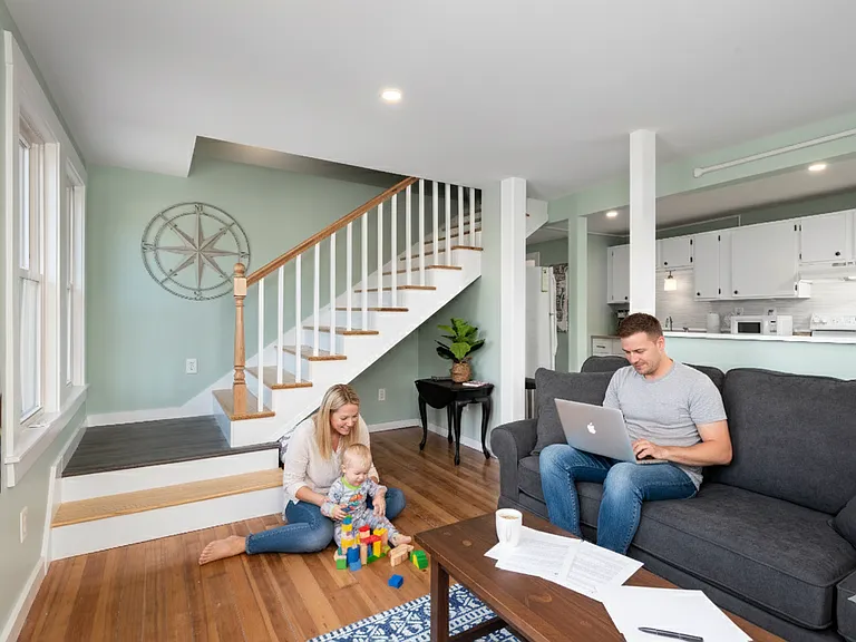 Enjoy the bright, versatile main floor that easily transitions from work to play. Featuring original hardwood floors, plenty of natural light, and stylish coastal decor, this space is ideal for catching up on emails while the kids play nearby, or simply r