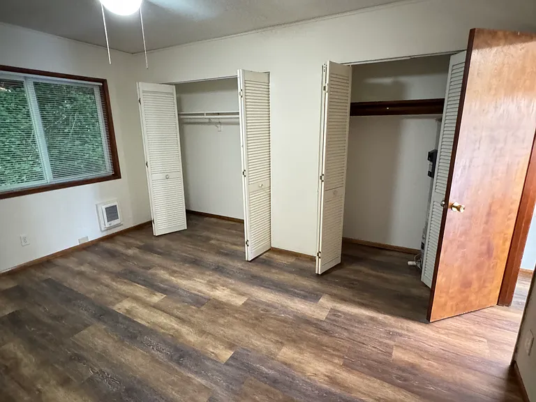 Two closets in back bedroom, the one on the right shares space with a brand new hot water Heater.