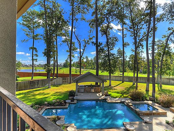  Located on a premium .61 acre lot, sprawling with mature trees! Notice there are no back neighbors!  The detention pond & walking trail behind the home provide a quiet setting as well as a beautiful view!