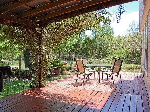 The wide-planked deck runs the length of the house is of quality construction.