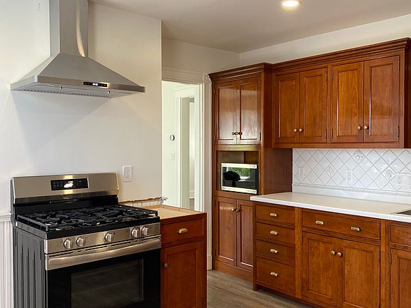 Kitchen - new gas stainless steel stove and hood