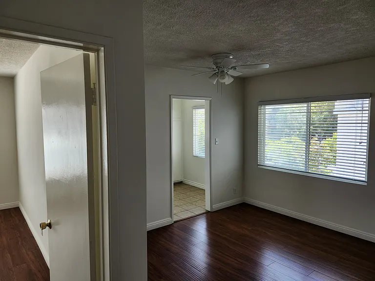 Hallway view of BR 2 and kitchen