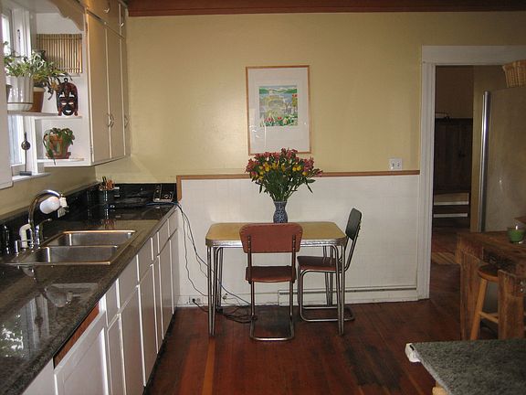 Kitchen with slab granite counters
