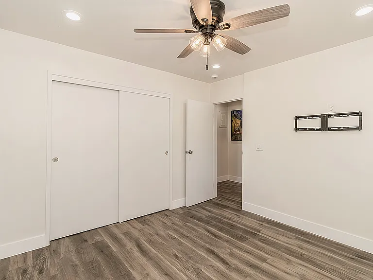 Bedrrom w/LVP Flooring, Dual Pane Windows, Fan and LED lighting.