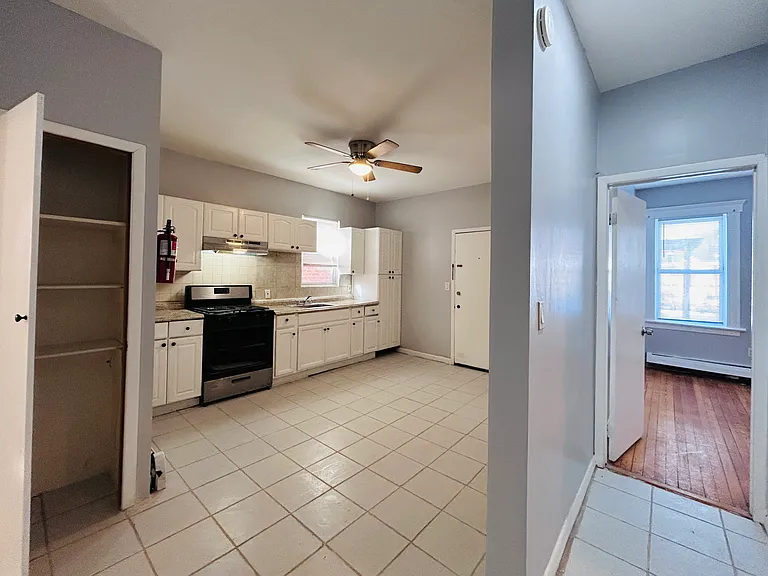 Kitchen is accessible easily from each of the three bedrooms and living room