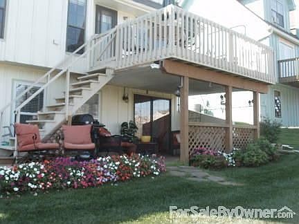 backyard flower garden : beautiful flower garden provides stunning view from pool and tennis courts