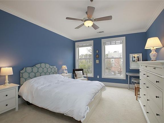 Generous bedroom boasts a walk in closet & marble spa bath.
