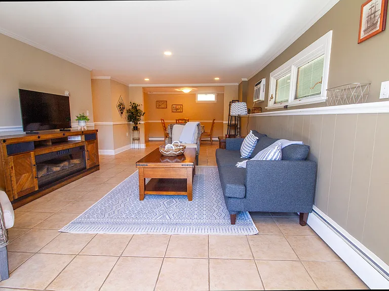 Full length of your entry view includes the living room and dining area.