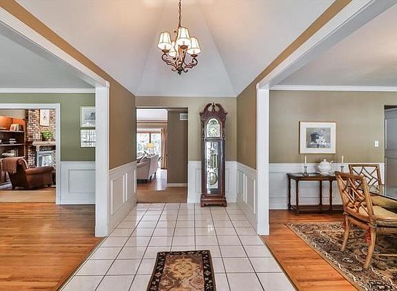Entry foyer with cathedral ceiling offers a wonderful view of the wide open floor plan