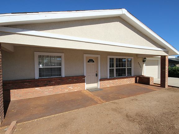 Covered porch+brick accents