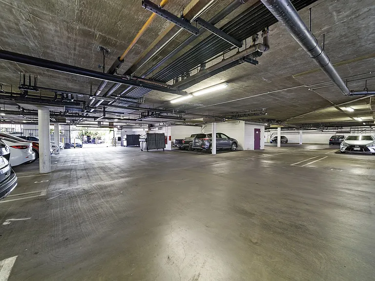 Controlled-access parking garage offering secure resident parking and added convenience.