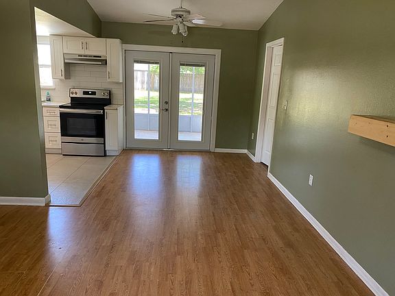 New french doors lead out to the screened porch.
