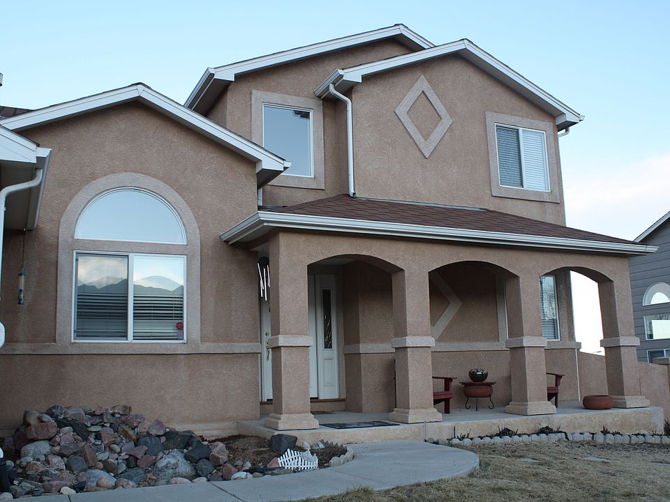 Covered front porch and koi pond