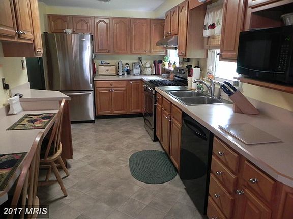 Abundant maple cabinets plus pantry