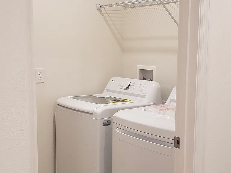 Spacious laundry room with nearly new LG Washer/Dryer Combo! Still under extended warranty!
