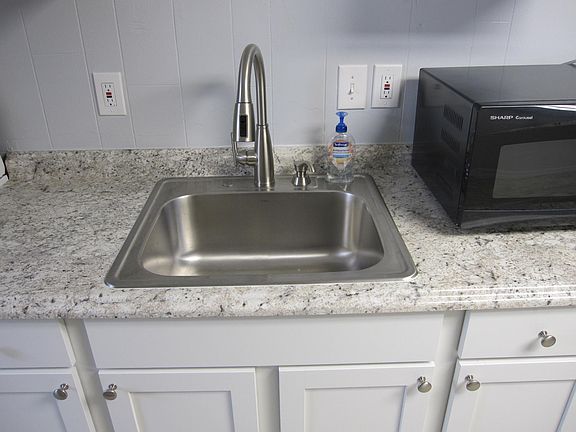 Close up picture of sink counter area.